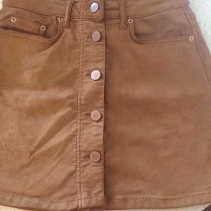 Camel colored polyester spandex skirt. Very cute